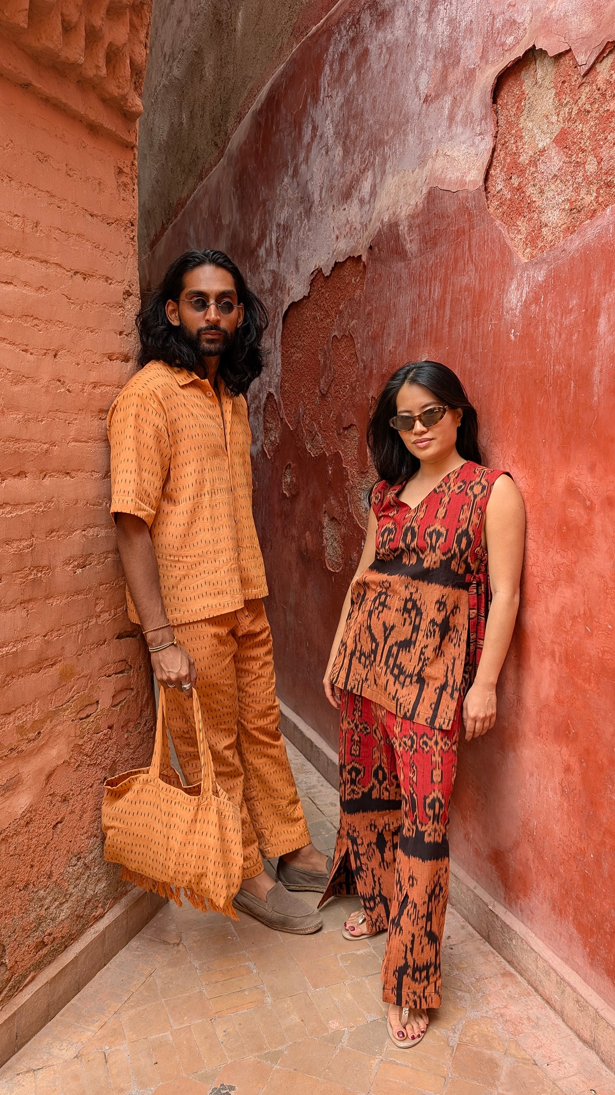 DJ HIMMAT (Aaqib Hasnain) and his wife Livy wearing matching HAYAQI sustainable fashion pieces in Marrakech, Morocco — their first brand campaign inspired by cultural heritage and conscious design.
