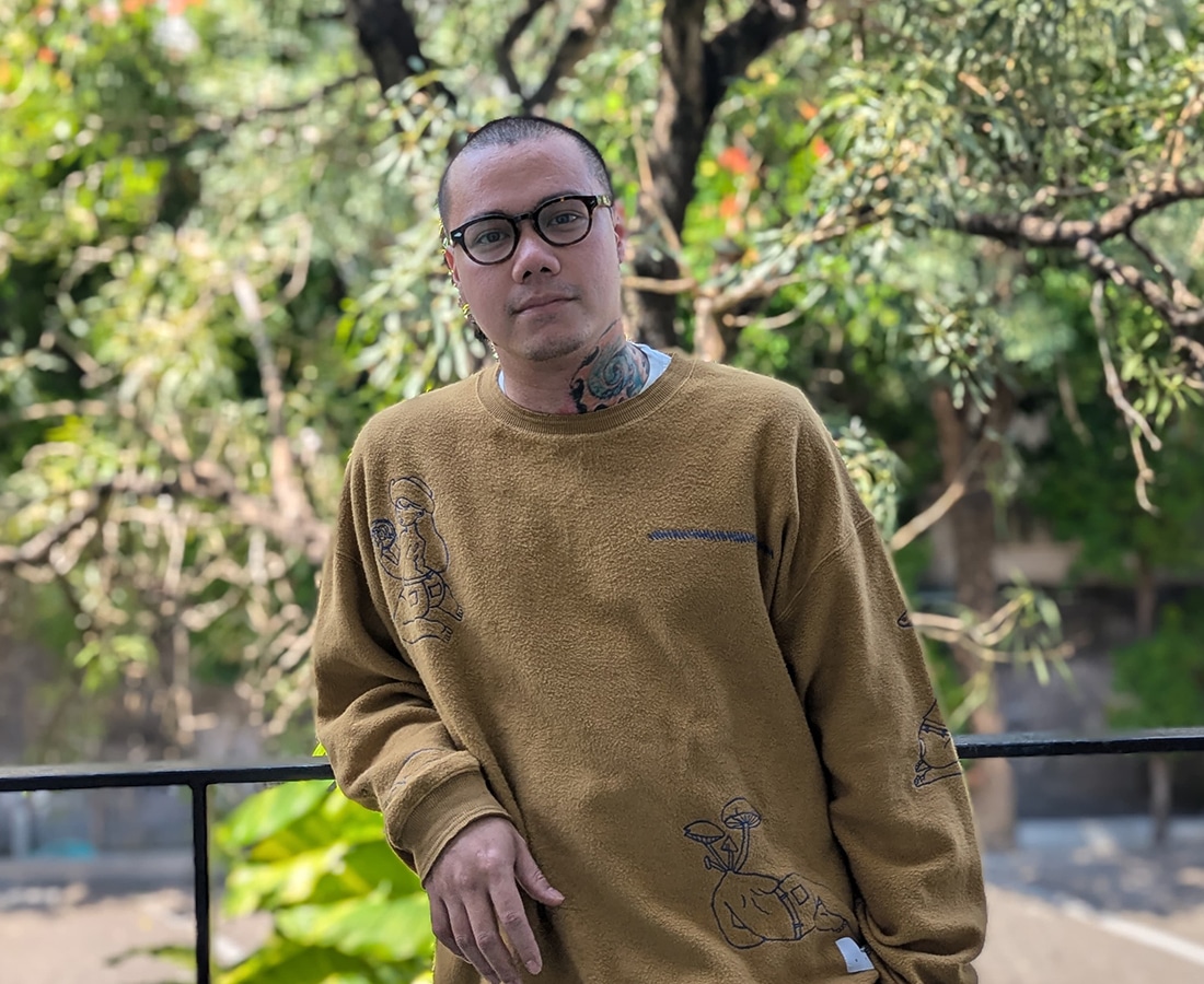 an image of archie dennis wth trees and nature in his background