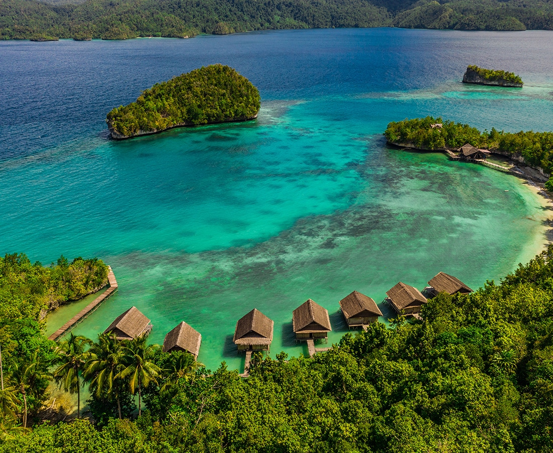 high angle of shot of overwater bungalows in Raja Ampat