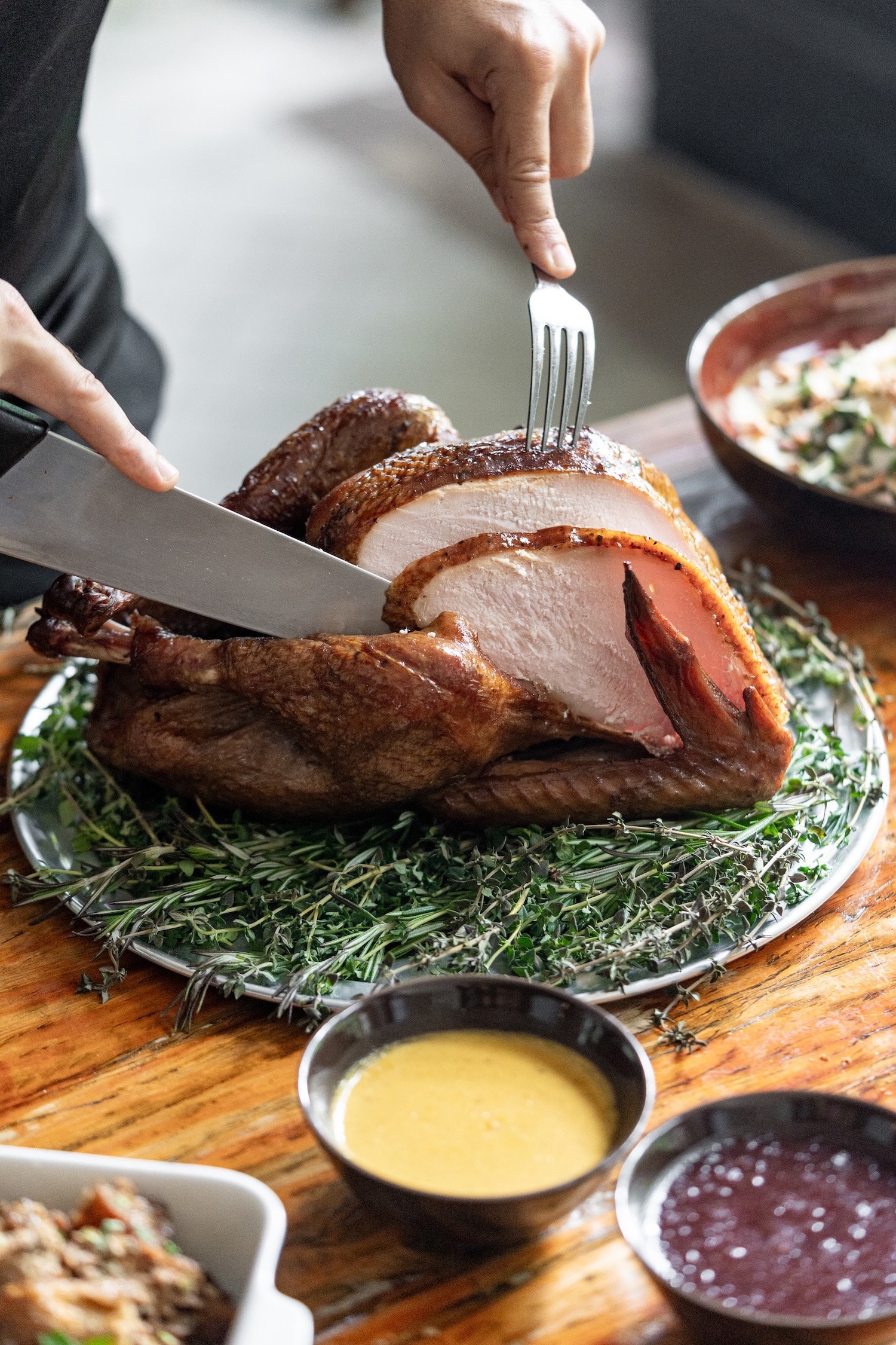 Smoked whole turkey being carved at Decker Barbecue Singapore, a top choice for corporate Christmas catering and in-office festive celebrations.