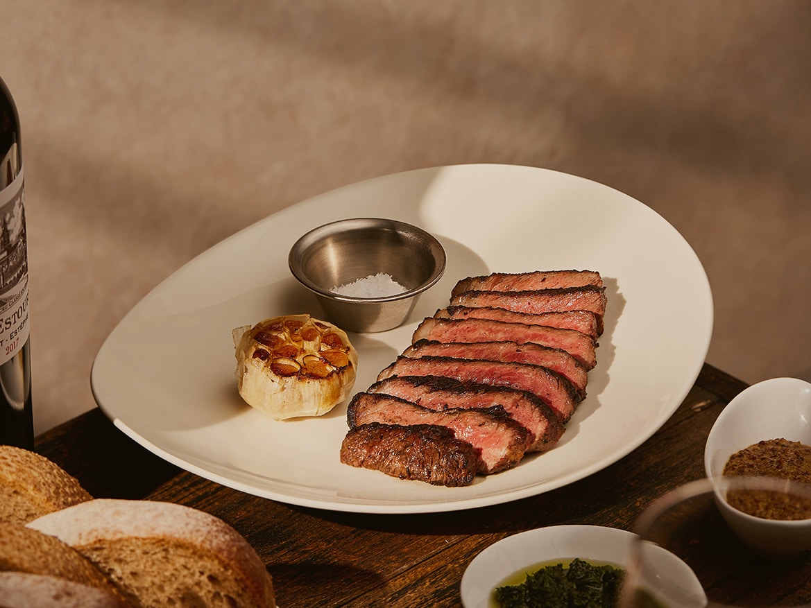 Sliced Full Blood Wagyu Denver steak with roasted garlic and sea salt at Fat Belly Singapore, a newly reopened woodfire grill restaurant