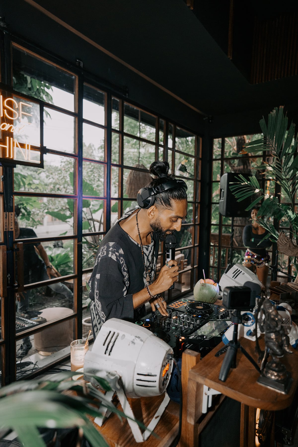 DJ HIMMAT performing at Rise & Shine Bali, bringing soulful morning energy to a tropical venue with lush greenery and conscious community vibes.