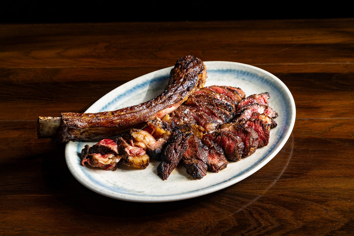 Little Joe grass-fed tomahawk steak grilled over woodfire at Il Toro Singapore, a bold new woodfire grill concept on Gemmill Lane