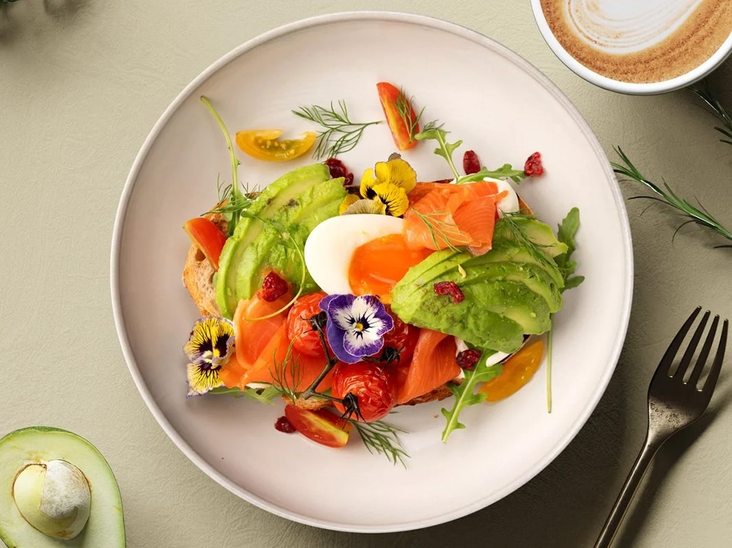 a brunch bowl of salmon slices, avocado, hard boiled egg at Halcyon & Crane brunch menu in Paragon shopping mall, Singapore