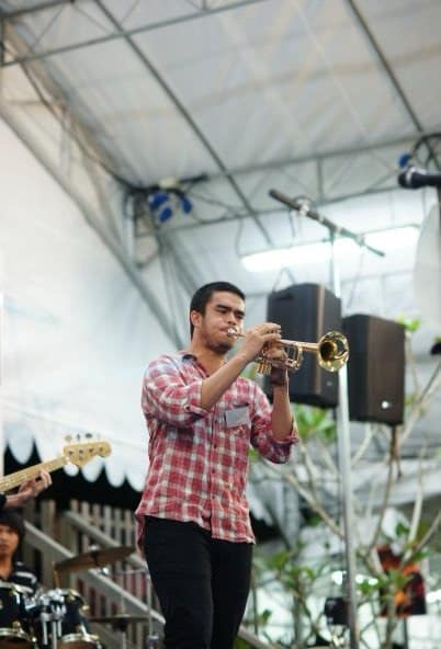 Daniel playing trumpet live with their ska band.