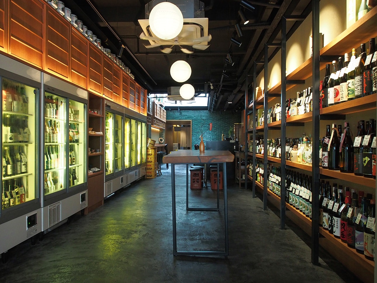 Sake cellar and tasting bar at Orihara Shoten, Mohamed Sultan Road – featuring curated bottles from artisanal Japanese breweries.