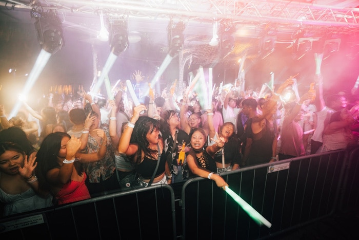 High-energy New Year’s Eve beach party crowd at Sand Bar Sentosa, Singapore