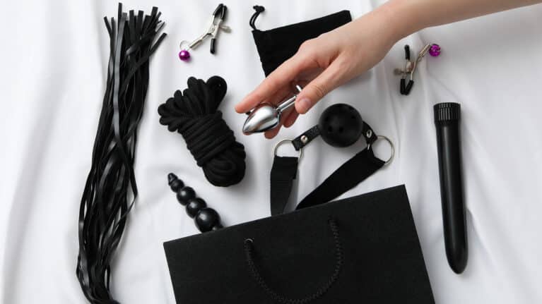 A collection of sex toys on a light background.