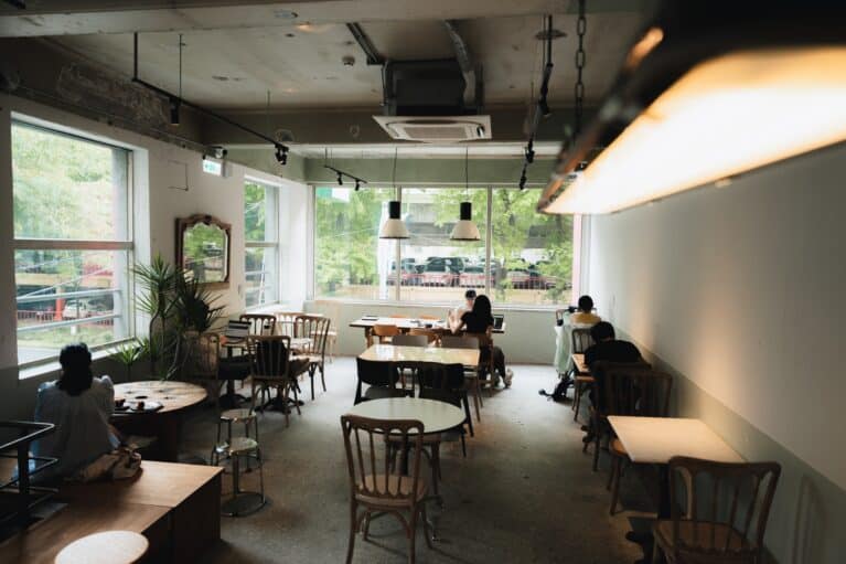 The interior of Twatutia Coffee Shop with a few patrons sitting.