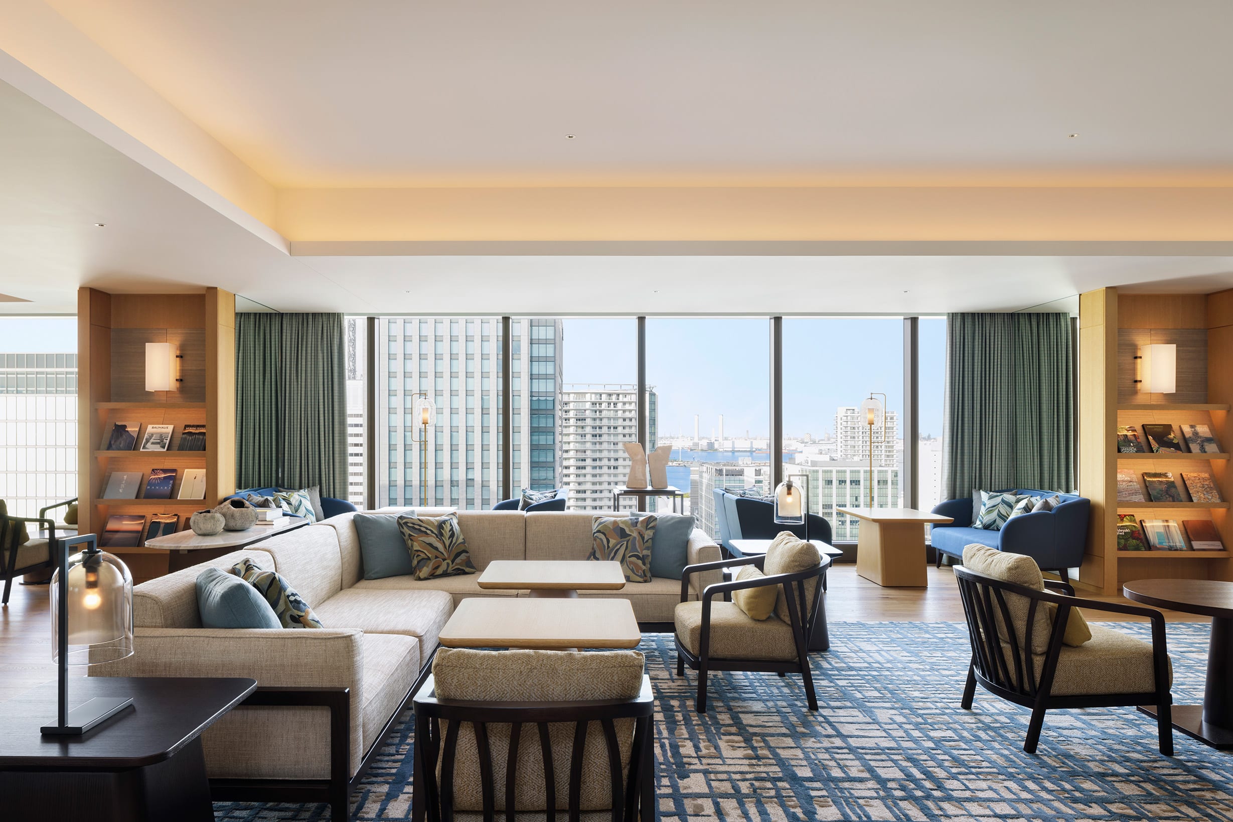 The Westin Club Lounge in Yokohama offers a sophisticated co-working and relaxation space, with panoramic views, plush furnishings, and curated reading nooks.