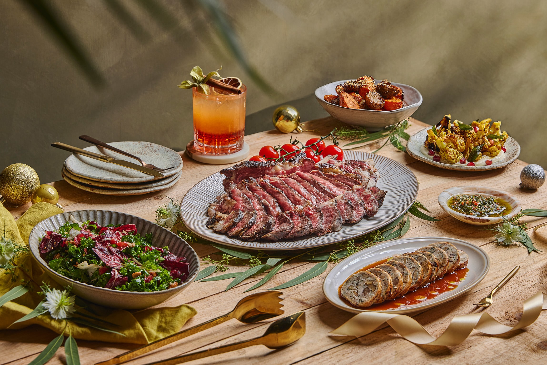 YARA Singapore Christmas takeaway featuring Akaushi prime rib, chopped salad, spiced sides, and chimichurri, set in a modern Asian holiday tablescape.