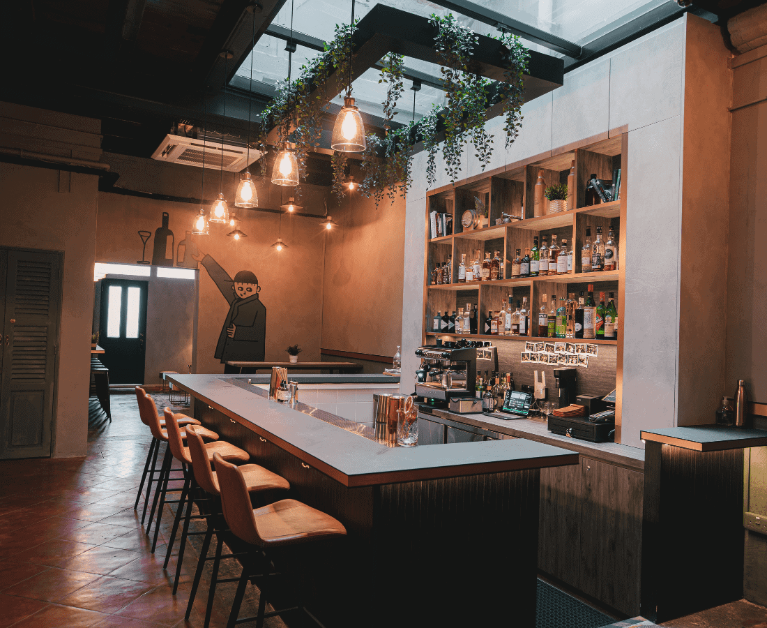 Intimate bar interior at The Store Singapore with warm lighting, curated cocktails, and a cosy happy hour vibe.